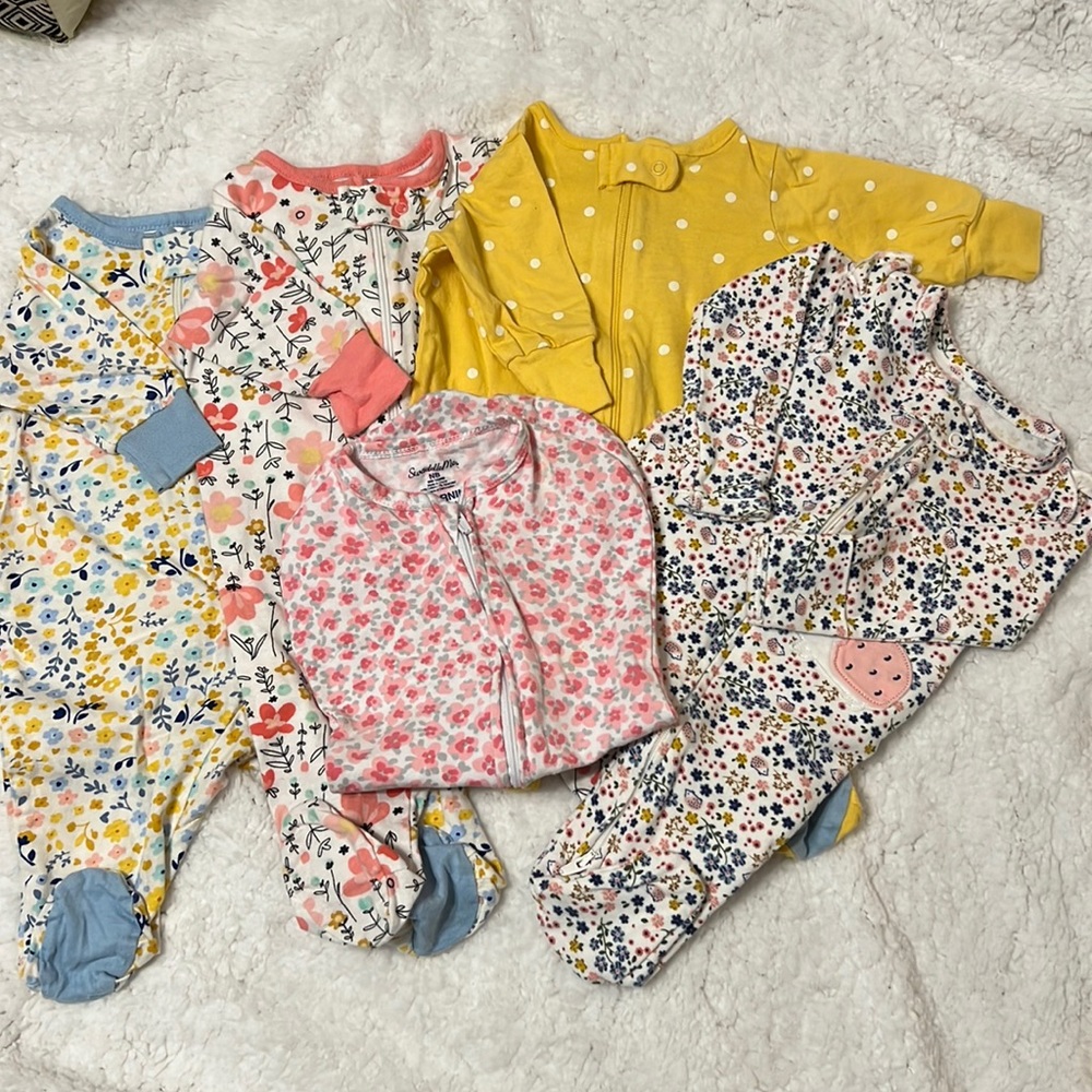 4 Newborn sleep and play footed outfits and a swaddle me